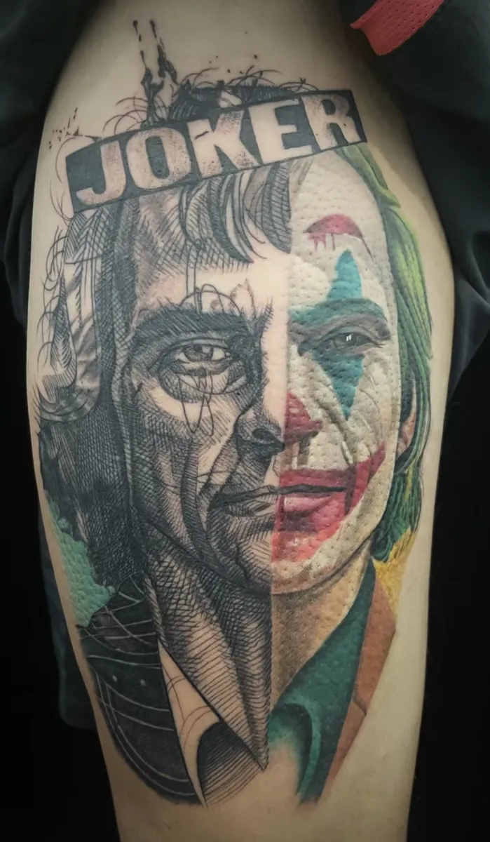 Dual-expression Joker black-and-grey portrait tattoo by Yuyi Tattoo in Singapore