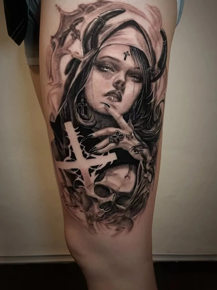 Dark horned character tattoo shown on a leg in a portrait-style composition